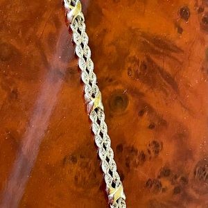 Braided sterling silver rope bracelet with 3 gold X’s as design accents